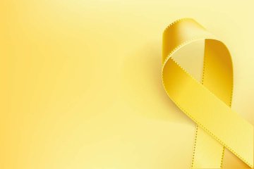 Geel lintje symbool dag tegen Kanker